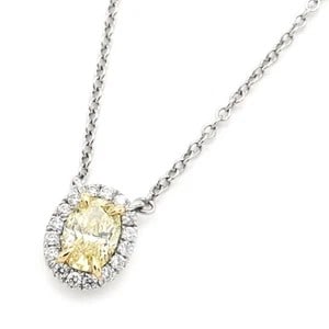 FANCY YELLOW DIAMOND OVAL HALO PENDANT NECKLACE WITH DIAMOND SURROUND (20TH-21ST CENTURY): FANCY YELLOW DIAMOND OVAL HALO PENDANT NECKLACE WITH DIAMOND SURROUND (20TH-21ST CENTURY) Provenance and Authenticity: This elegant pendant necklace features a centrally mounted oval-shaped yellow gem