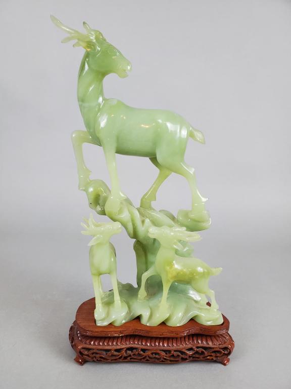 Antique Chinese Carved Staggs Xiuyan Jade This wonderful detailed group of Staggs atop a rocky base: This wonderful detailed group of Staggs atop a rocky base on beautiful carved wooden base. Appears to be in good. No chips or cracks. 13 1/4" height, 7" width and 3 1/2" depth.