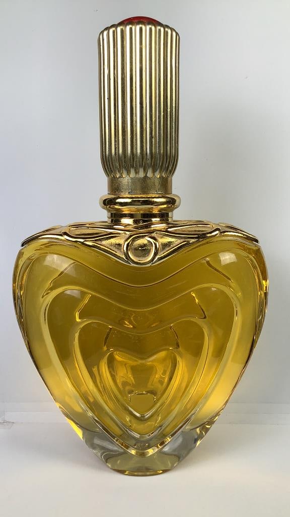 Vintage Escada Margaretha Ley Factice Perfume Bottle Origin: Private estate Material: Glass & liquid: Bottle Origin: Private estate Material: Glass & liquid Measures: 14" tall Condition: Some fading on the goldtone & top is detached from the glass bottle. WHAT IS A FACTICE? Factice are perfume bottles
