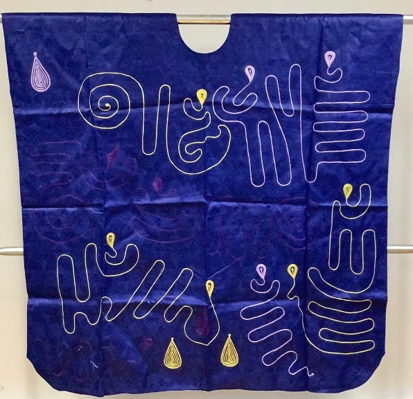 Navy Blue Embroidered African Print Kaftan Origin: Private estate Material: Embroidered cloth: Origin: Private estate Material: Embroidered cloth Measures: 57"L, one size fits most Condition: Very good handmade condition