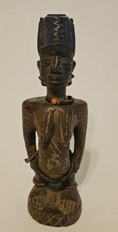 Nigerian Ibeji Carved Wooden Figurine #1 Figures like these, called ibeji, are memorials to deceased: Figures like these, called ibeji, are memorials to deceased twins. Their elaborate hairstyles and beaded jewelry mark their honored status. When one twin dies, a single sculpture is commissioned and c