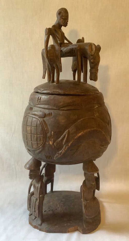 Carved African Tribal Vessel Origin: Private estate Material: Wood Measures: 23"tall Condition: Some (1 of 8)