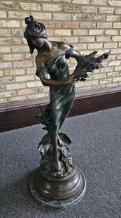 Bronze Sculpture After Moreau Lady with Wheat PROVENANCE: Private: PROVENANCE: Private estate MATERIAL: Bronze ARTIST: Auguste Moreau DIMENSIONS: 40" tall ARTIST INFORMATION: Auguste Moreau (1834 – 1917) was a French sculptor born in Dijon. The third and young