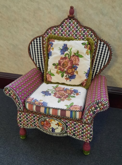 Mackenzie Childs Outdoor Wing Patio Chair PROVENANCE: Private: PROVENANCE: Private estate MAKER: Mackenzie Childs MATERIAL: Resin Wicker DIMENSIONS: 50" tall, 38" wide and 30" deep CONDITION: Cushions need to be cleaned