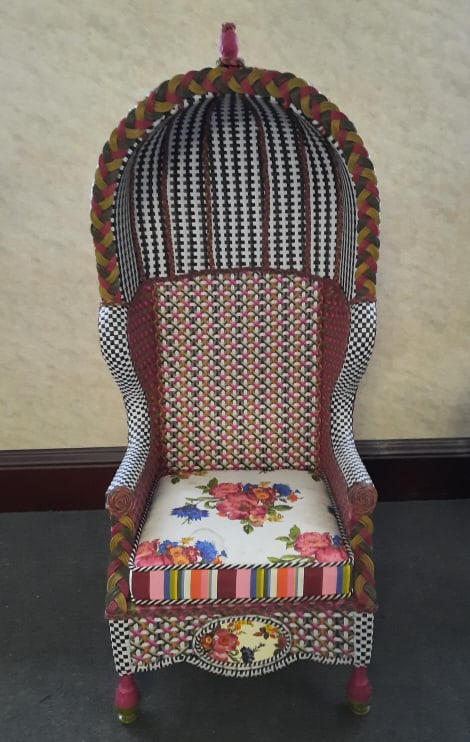 Mackenzie Childs Greenhouse Bonnet Chair PROVENANCE: Private: PROVENANCE: Private estate MAKER: Mackenzie Childs MATERIAL: Resin Wicker DIMENSIONS: 70" tall, 32" wide and 29" deep