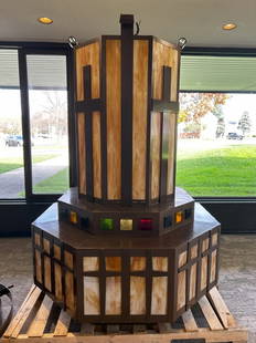 Large Mission Style Stained Glass Chandelier PROVENANCE: Plymouth Congregational Church Lansing,: PROVENANCE: Plymouth Congregational Church Lansing, MIMATERIAL: Wood & stained glassDIMENSIONS: 84"tall, attached bottom piece is approximately 55" in diameter. CONDITION: Very good. Custom made.