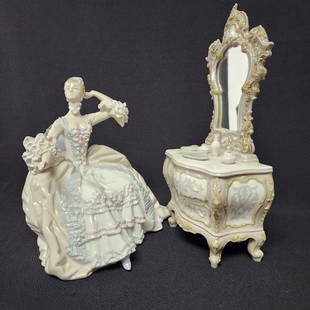 Lladro Lady At Dressing Table #1242 2 Piece: No table. PROVENANCE: Private estate MATERIAL: Porcelain DIMENSION: 9"tall CONDITION: Very good