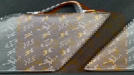 Louis Vuitton Monogram Wallet MANUFACTURER: Louis Vuitton MATERIAL: Leather DIMENSIONS: 10": MANUFACTURER: Louis Vuitton MATERIAL: Leather DIMENSIONS: 10"