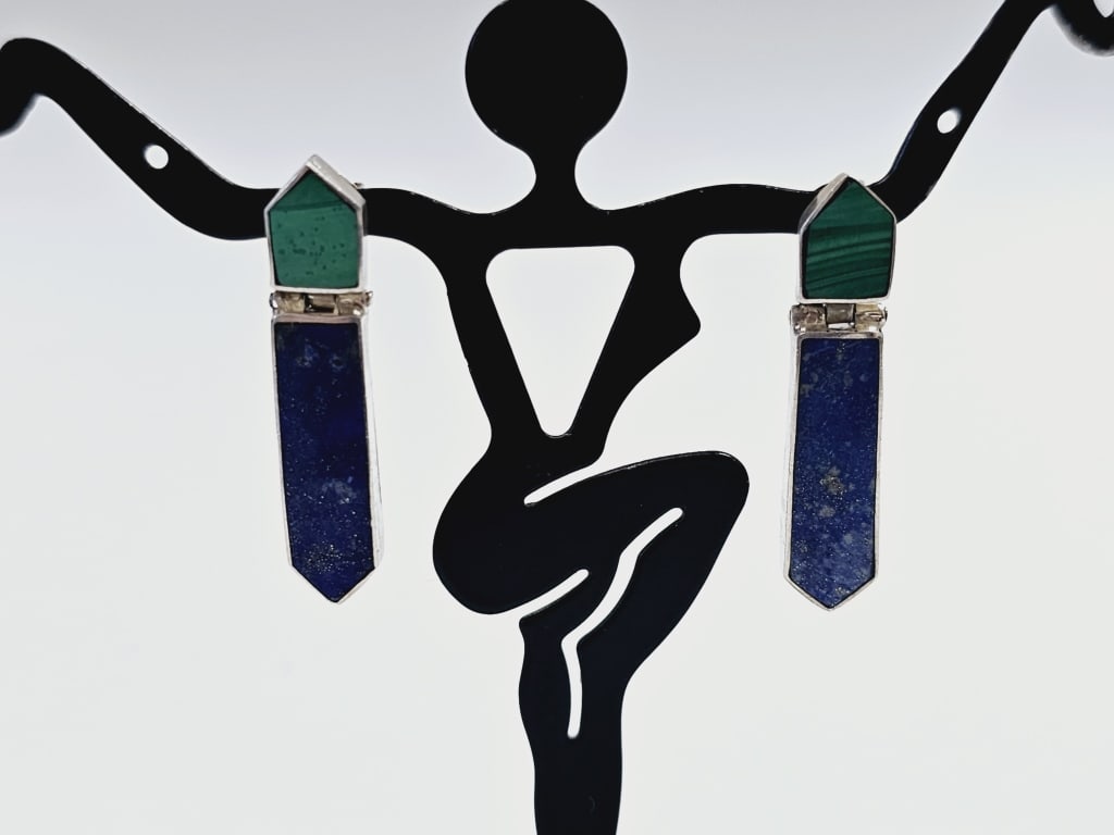 900 Silver Lapis & Malachite Earrings Earrings weigh 5.5: Earrings weigh 5.5 Grams These are dangle earrings with a geometric design, featuring lapis lazuli and malachite stones set in sterling silver. Each earring features a long, rectangular lapis lazuli s