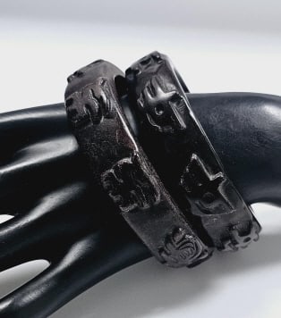 Heavy Stone Carved Asian Bangle Bracelets This is a pair of black bangle bracelets made of stone. (1 of 7)