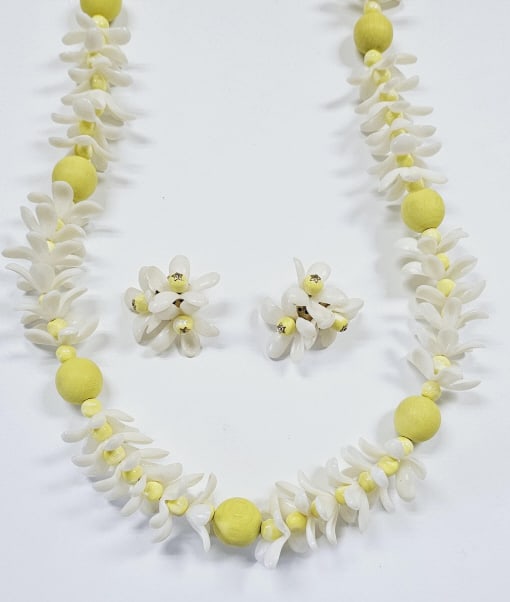 Vintage Castle Cliff Flower Cluster Necklace Set Necklace measures: Necklace measures 30" This is a vintage necklace and earring set featuring delicate white flowers and pale yellow beads. The flowers are arranged in clusters along the necklace, interspersed with the