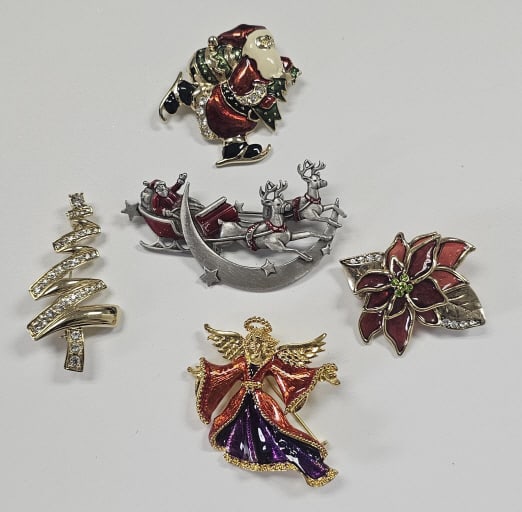 Christmas Brooches Inc Christopher Radko Top Left: A brooch of Santa Claus ice skating while (1 of 5)
