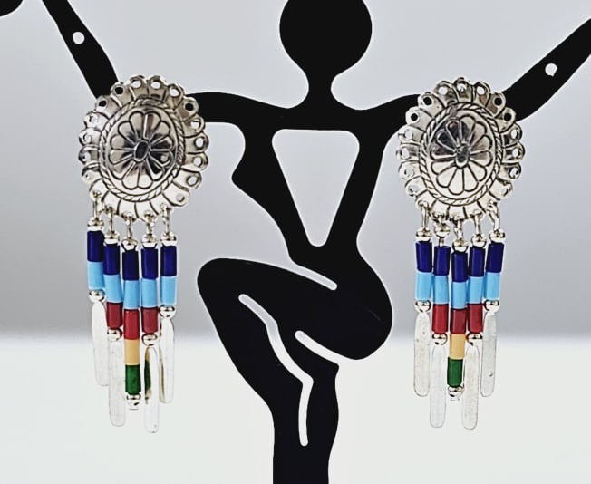 Native American Sterling Silver Multi Gem Earrings Earrings weigh 3.7: Earrings weigh 3.7 Grams The Vintage Native American Multi Gem Bead Sterling Silver Earrings are made of sterling silver and feature turquoise, lapis lazuli, coral, spiny shell oyster, and malachite.