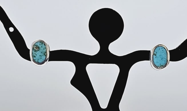 Sterling Silver Oval Shaped Turquoise Earrings Earrings weigh 1.6: Earrings weigh 1.6 Grams This is a pair of stud earrings. Each earring features an oval-shaped turquoise stone set in a silver bezel. The turquoise stones have a beautiful blue-green color with natura