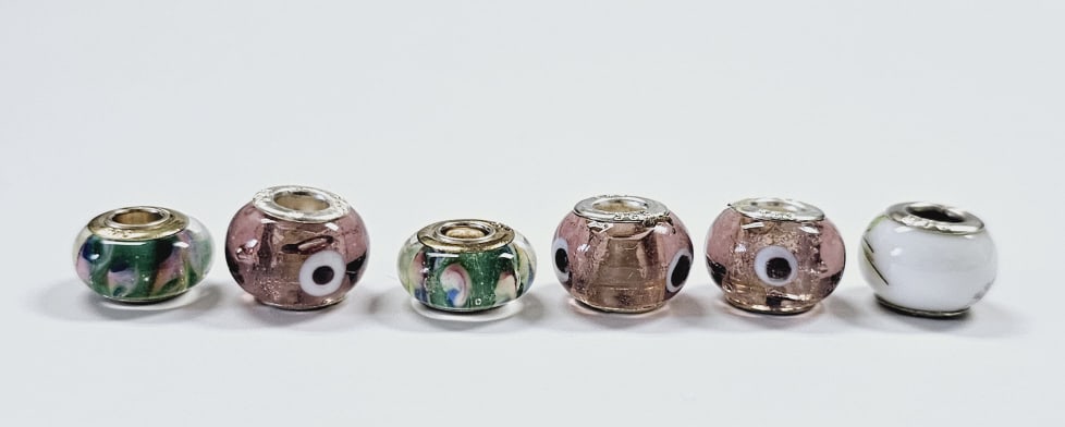 6 Sterling Silver Murano Glass Beads Six glass Murano beads with sterling silver threading holes.: Six glass Murano beads with sterling silver threading holes.