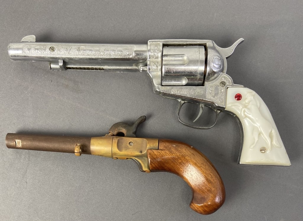 Flintlock Replica & Stallion 45 Cap Gun Toys Nichols Stallion 45 cap gun toy and wooden flintlock: Nichols Stallion 45 cap gun toy and wooden flintlock gun replica, marked CMC 12050A.