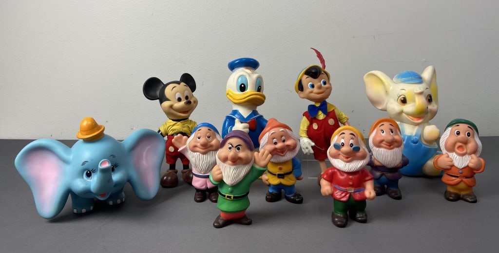 Walt Disney Vintage Toys Mickey, Donald, Dumbo Set of vintage mid century plastic Walt Disney: Set of vintage mid century plastic Walt Disney Productions toys. Donald and Dumbo are made in Japan. Mickey, Pinocchio, and six Dwarfs (Dopey is missing) are marked Made in Hong Kong. Also includes is