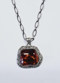Sterling Silver Domed Amber Pendant Necklace Necklace weighs 17.9 Grams Measures 24"
