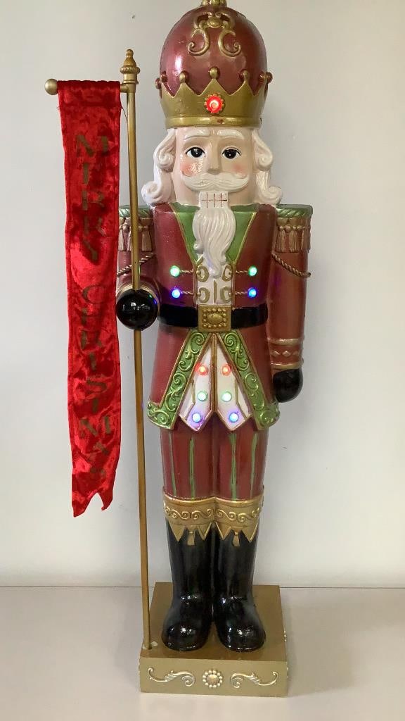 Vintage Lighted Merry Christmas Nutcracker Soldier Measures: Measures 39"tall. There are some chips on the paint. In overall good condition. He comes with a cardboard box for storage.