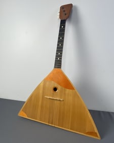 Balalaika Russian Stringed Instrument Triangle shaped wooden instrument from Russia. Small chip at