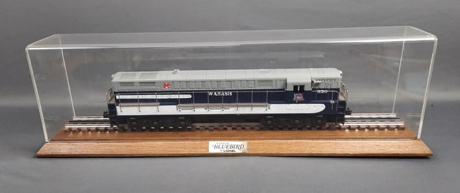 Lionel Wabash Bluebird O Gauge in Display Case is wooden and plastic. Small cracks in plastic of