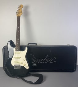 Vintage Fender Stratocaster Guitar with Case Black and white Fender Stratocaster from the 80's.