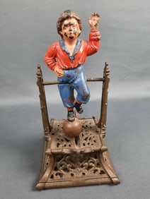 Antique Cast Iron Boy On Trapeze Penny Bank Please see images for details regarding condition.