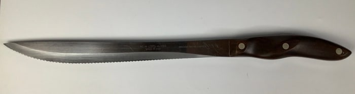 Brown Handle Cutco Serrated Carving Knife #1023 Please see images for details regarding condition.