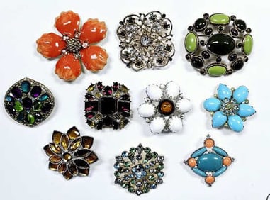Collection of 9 Brooches including Monet Orange flower brooch missing a center rhinestone