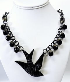 Hotcakes Design Carved Resin Bird Necklace Necklace measures 30"