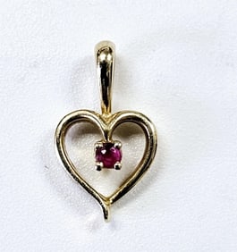 14K Yellow Gold Ruby Heart Pendant Pendant weighs .68 Grams