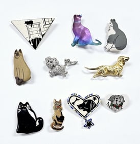 Assorted Dog & Cat Brooches Made of metal and pottery.