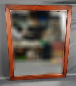 Antique Wooden Framed Wall Mirror Measures 27" x 33". Some hazing & scratches present. Wood panel on