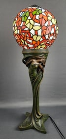 Vintage Stained Glass Globe Art Nouveau Style Lamp Table lamp with multicolored glass globe.