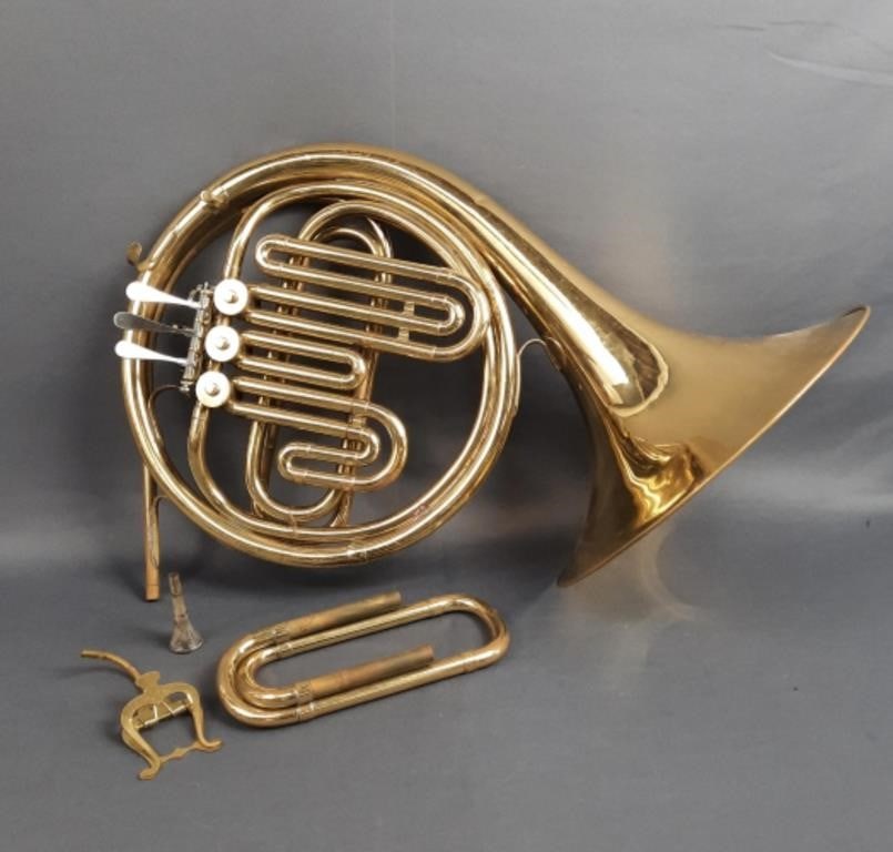 Vintage Holton Collegiate French Horn with Case Some tarnishing and dents, case has damage. Please: Some tarnishing and dents, case has damage. Please see images for details regarding condition.