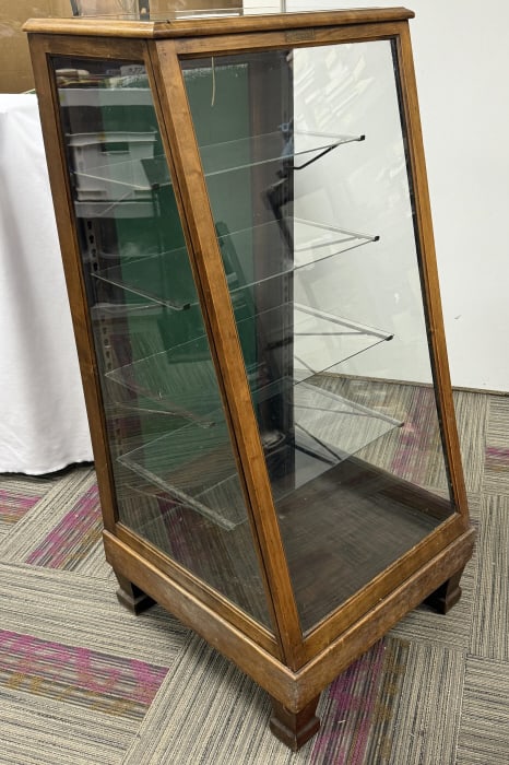 Antique Slanted Glass Display Case Showcase Wood and Glass. Mor-Sho-Cases made by Morton Show Cases: Wood and Glass. Mor-Sho-Cases made by Morton Show Cases Inc Washington Ohio. 23 inches wide 13.5 inches deep at top 23.5 inches at bottom 48.5 inches tall. Some signs of age overall no cracked glass s