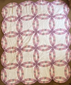Double Wedding Ring Quilt Pink and white quilt in the double wedding ring pattern. Quilt is 100 X 80