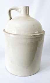 Antique Stoneware Jug Measures 13" tall. Condition consistent with its age.