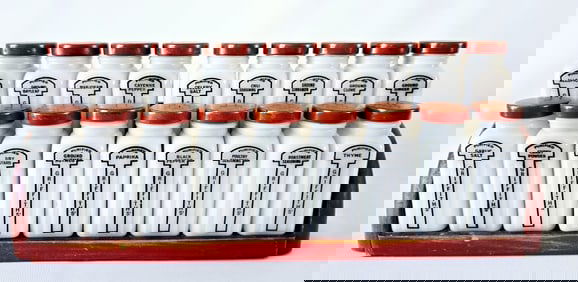 Vintage Griffith Milk Glass Spice Jars Wooden Rack Note condition of lids. Otherwise no chips or