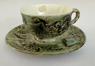 Majolica Seashells Cup and Saucer Cup measures 3.5 x 2 inches. Saucer 5.5 inches. No cracks or