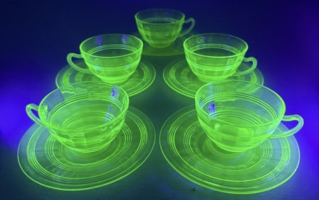 Uranium Glass Cup and Saucer Lot 5 sets plus 4 extra saucers One small chip in one cup otherwise