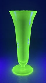 Uranium Vaseline Glass Vase 8.25 inches tall chip on edge. No cracks.