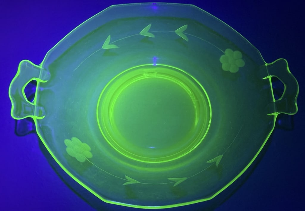 Uranium Glass Etched Octagonal Bowl w Handles 9 inches wide. Approximately 2 inches deep. Chip on (1 of 6)