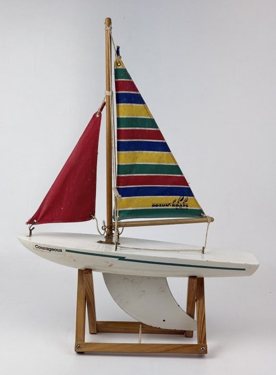 Vintage Bosun Boats Toy Sailboat Courageous 14.5 inches tall when on stand. Some paint loss and: 14.5 inches tall when on stand. Some paint loss and light rust on Keel fin. Some paint chipping on boat body.