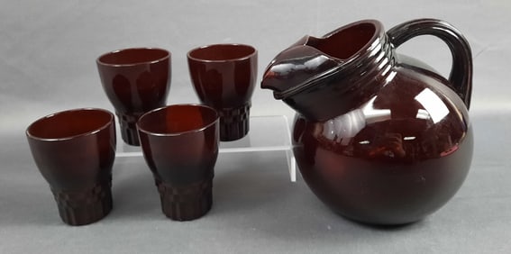 Ruby Red Glass Slanted Pitcher and Cup Set Surface scuffs and scratches present. Small chip on the