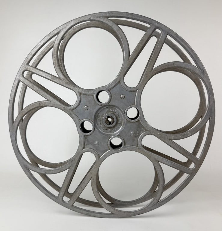 Goldberg Bros 35mm Film Aluminum House Reel 15 inches in diameter. From closed movie theater: 15 inches in diameter. From closed movie theater collection. Signs of age/wear. No cracks or breaks.