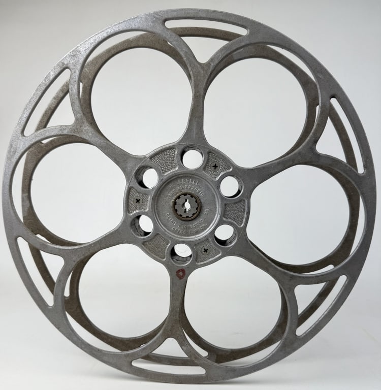 Millereel 35mm Film Aluminum House Reel 15 inches in diameter. Detail Production Co. From closed: 15 inches in diameter. Detail Production Co. From closed movie theater collection. Signs of age/wear. No cracks or breaks.