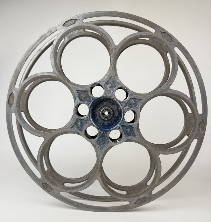 Goldberg Bros 35mm Film Aluminum House Reel 15 inches in diameter. From closed movie theater: 15 inches in diameter. From closed movie theater collection. Signs of age/wear. No cracks or breaks.