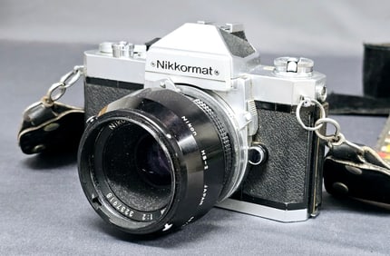 Nikon Nikkormat FT2 35mm SLR Camera With case and vintage strap. Case very dried out and cracking.