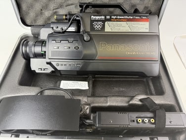 Panasonic OmniMovie VHS HQ Camcorder No battery. Powers on when plugged into charger/ac adapter.